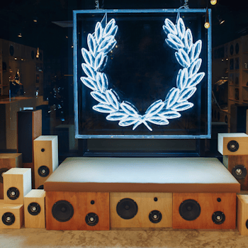 The Fred Perry Laurel Wreath Store in Singapore, designed by Studio Königshausen, pays homage to music and youth culture through its unique design. 